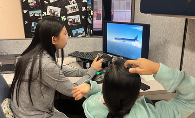 Students using flight simulator