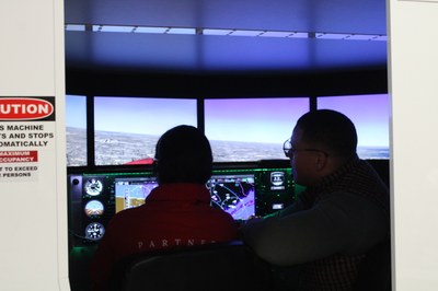Student in Redbird Flight Simulator