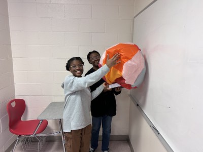 Students showing off their hot air balloon
