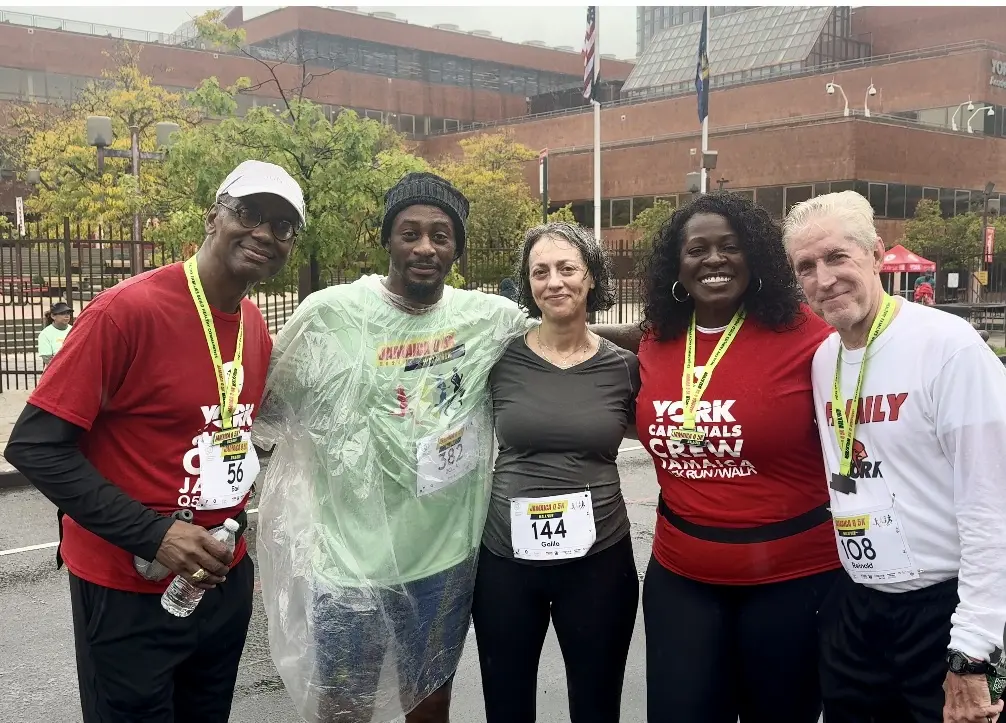 Dr. Schrader celebrates with faculty and staff